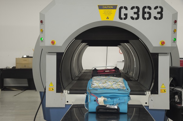 Luggage is screened at an airport.
