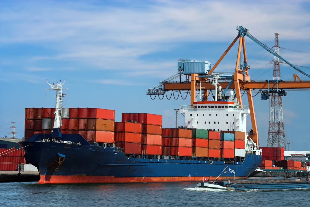 Container ship pulling into a port of entry