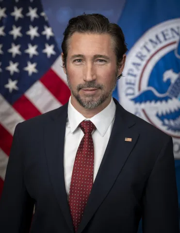Caption: Christopher Pratt Official Portrait at DHS Headquarters (DHS Photo by Tia Dufour)