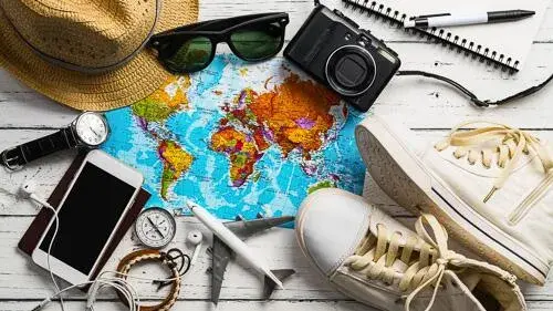 World map and assorted travel items