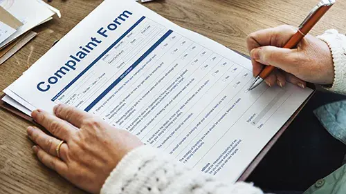Person filling out complaint form