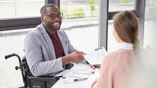 Image of man handing a document off