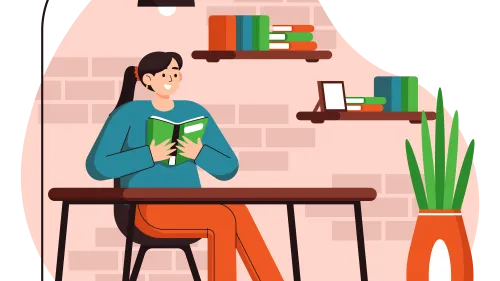 A woman sits under a lamp reading a book