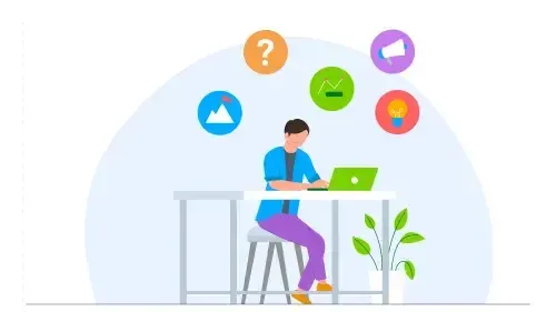 Man sitting at a table looking at a computer while taking a test