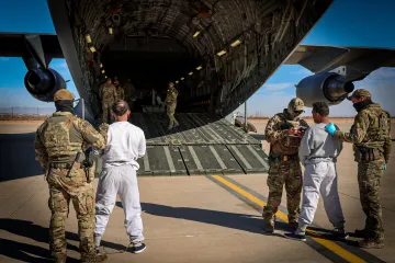 Caption: <p>DHS Releases Images of the First Flight of Criminal Aliens to Guantanamo Bay</p>